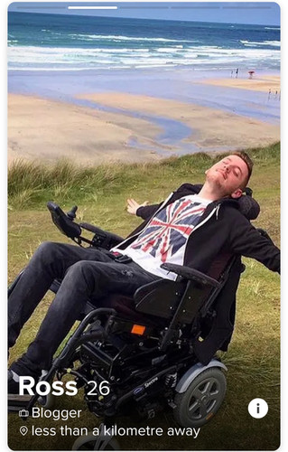 Ross reclined back in his wheelchair with beach views in the background