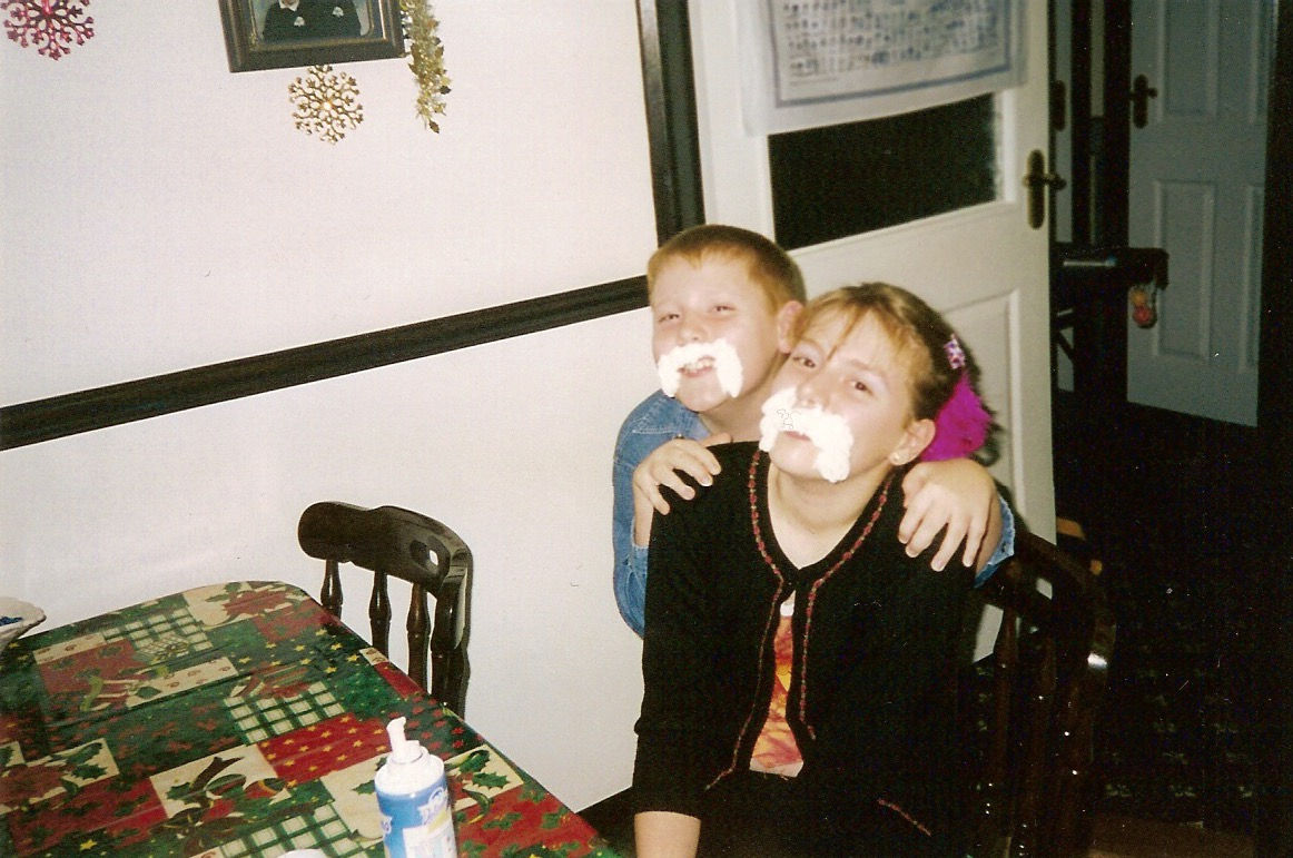 Young Ross and his sister with whipped cream moustaches