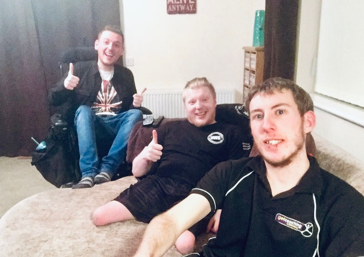 A selfie of Ross, Mark & James, sat around the sofa