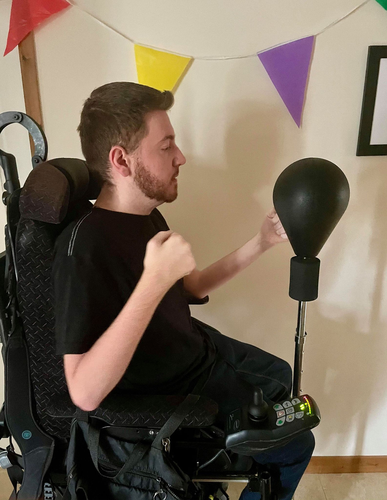 Side profile shot of Ross about to hit his punchbag