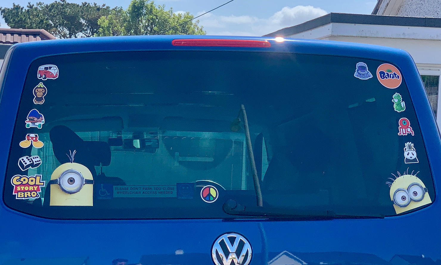 A handful of stickers stuck to the back window of Ross's car