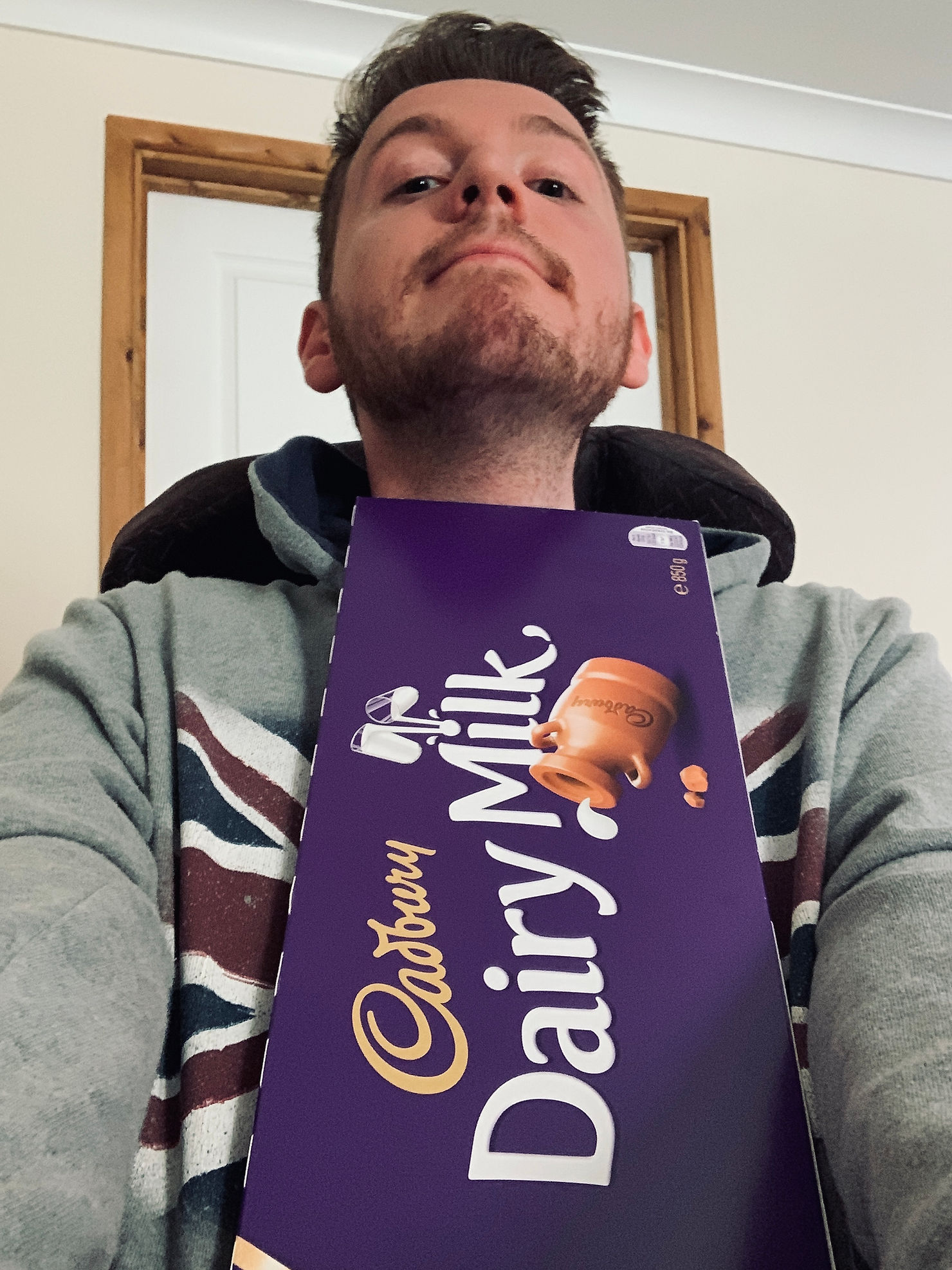Selfie of Ross's holding a massive 850g dairy milk chocolate bar