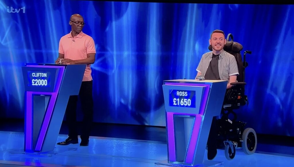 Ross and contestant Clifton behind their podiums.