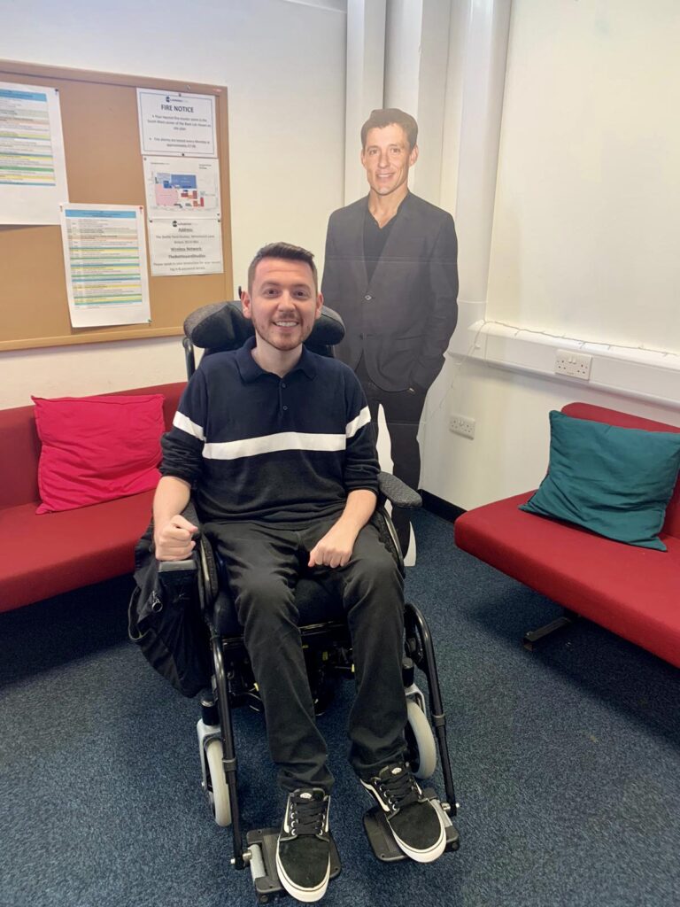 Ross sat in his wheelchair in front of a large cardboard cut-out of Ben Shephard.