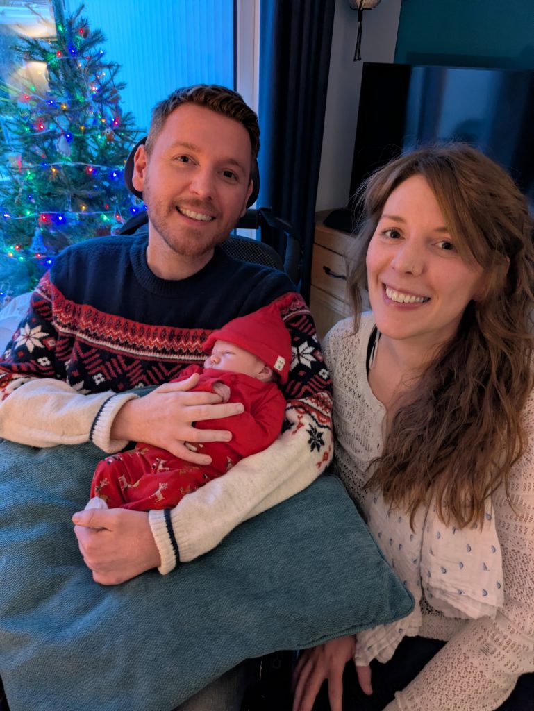 Ross holding his baby nephew Max, next to his sister Rose.